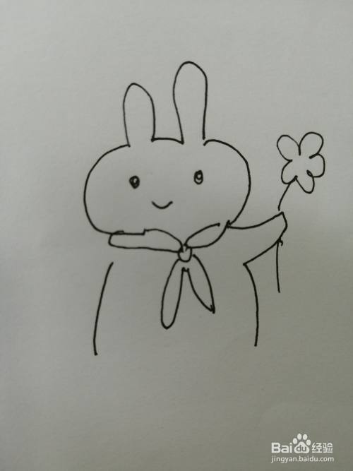 接着在可爱的小兔子的小手上画出一朵漂亮的小花,小花画法比较简单