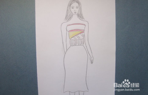 然后,用黑色的彩铅笔画出半身直筒裙服装的整体图形,并画出衣服上装饰
