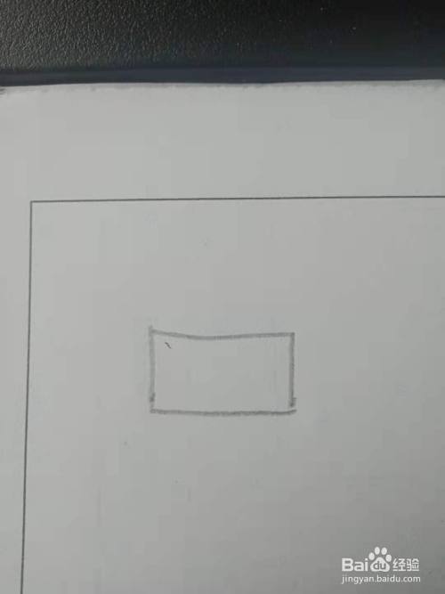首先我们在画纸上面画出一个长方形,也可以是其他的图形.