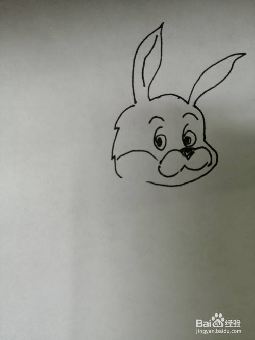 第三步,接着继续画出可爱的小兔子的小鼻子和微笑的小嘴巴,注意鼻子
