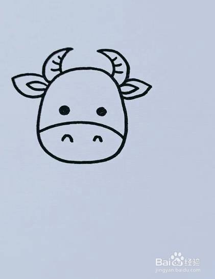 接着画出牛的眼睛及鼻孔.