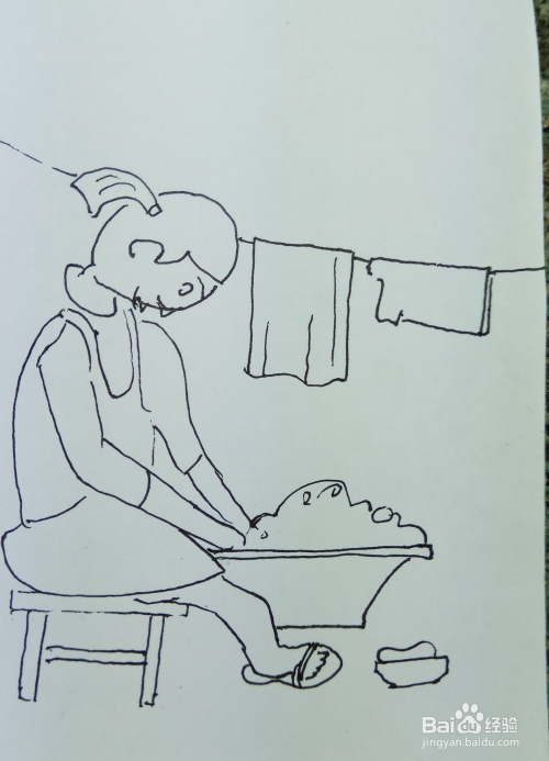 并画出她面前的一个水盆的外形轮廓,她正在洗衣服呢