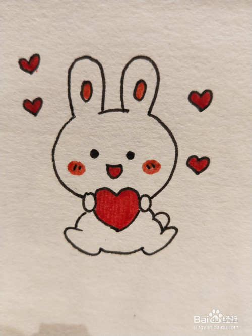 4 画出小兔子的五官,并在周围点缀一下爱心. 5 简单涂上颜色,完成!