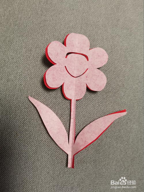 儿童剪纸:对称连边花朵