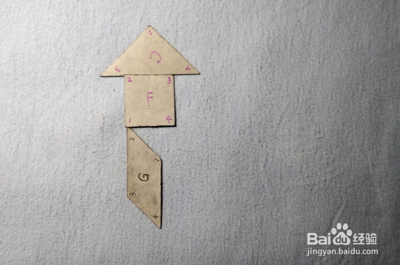 用七巧板怎样拼一个拿着手绢的女士?