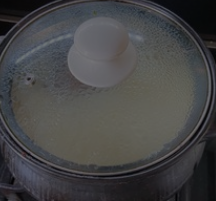 三文鱼头炖豆腐的做法