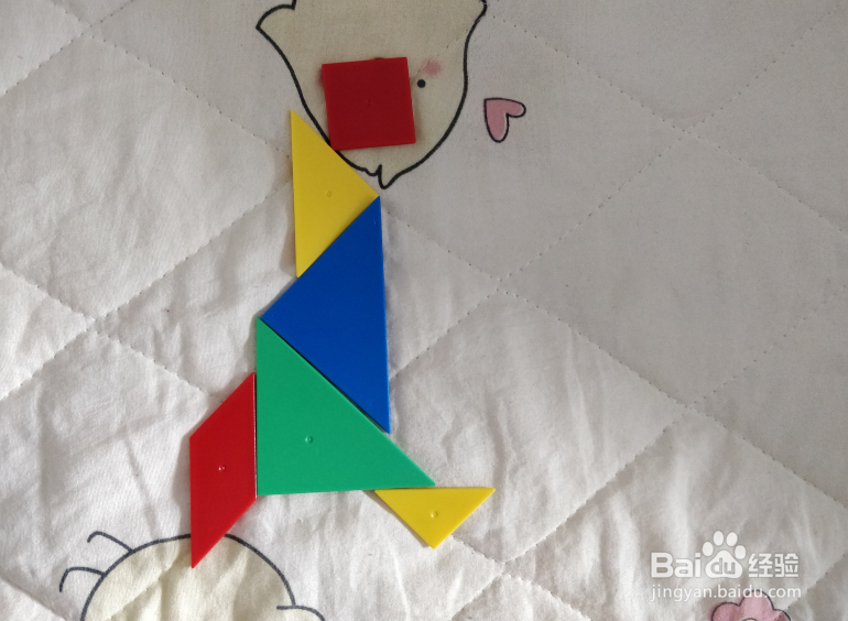 用七巧板智力拼图怎么拼一个跑着的娃娃