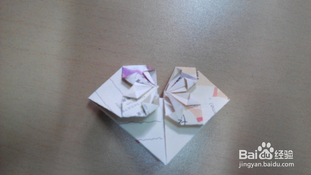 利用纸币或者折纸折一颗心的折法