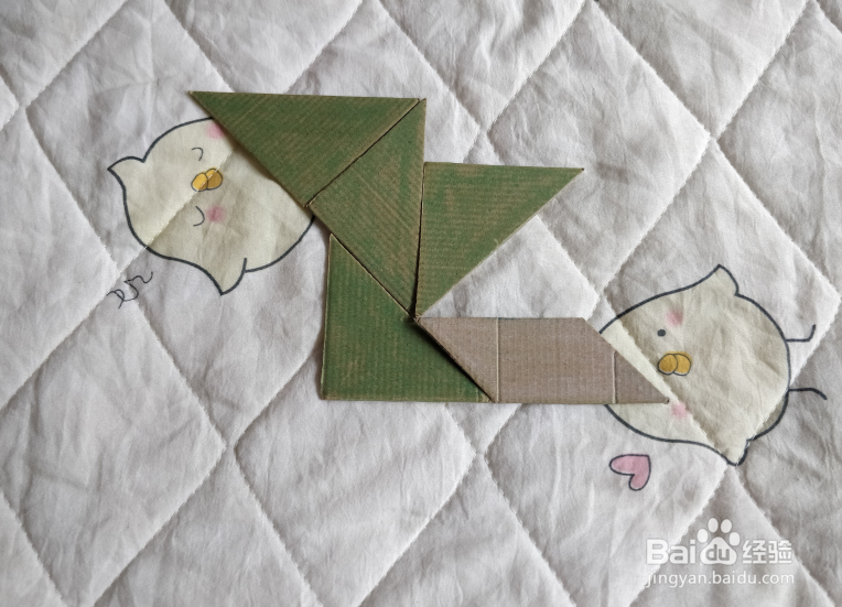 用九巧板怎么拼一个弹跳练习的小哥哥呢？