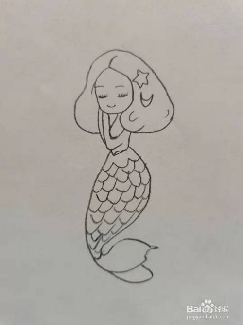 第五步,我们画美人鱼的鱼尾.