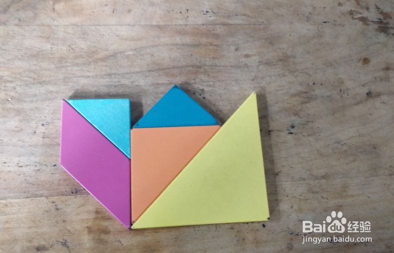 用七巧板怎样拼坐摇摇车的小孩儿