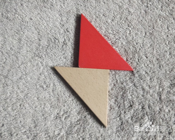 用七巧板怎样拼一个飞跨小水沟的小学生呢？