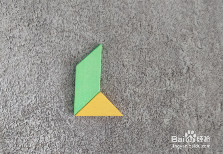 用七巧板怎样拼一个坐船尾的男士