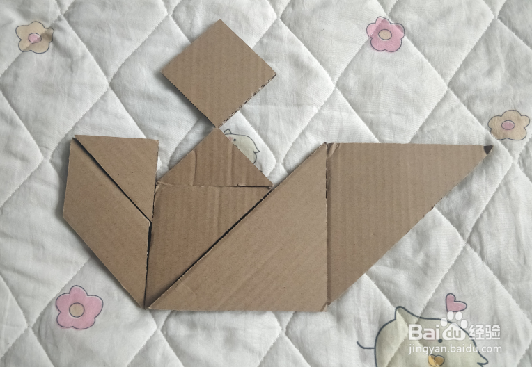 用七巧板怎么拼一个坐船的游客呢