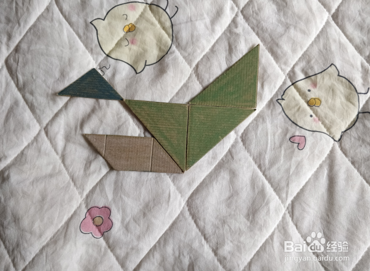 用九巧板怎么拼一个练习游泳的小哥哥呢？