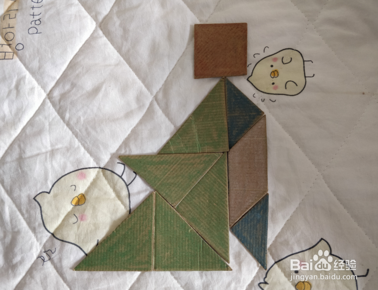 用九巧板怎么拼一个正在讲课的老师呢?
