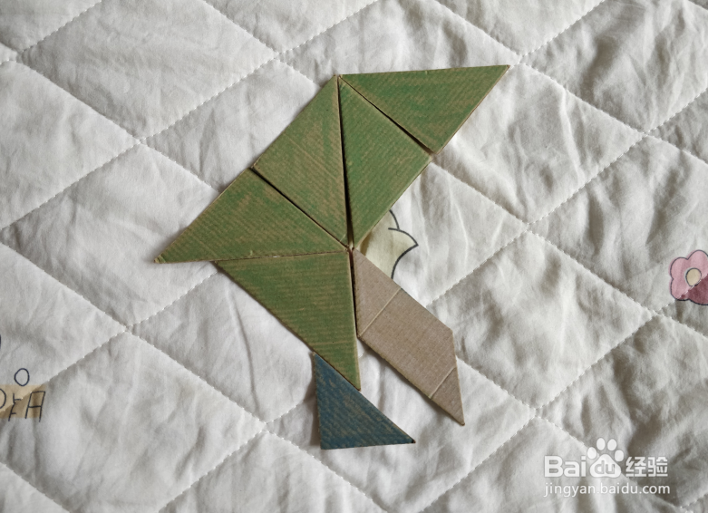 用九巧板怎么拼一个练习舞步的小哥哥呢？