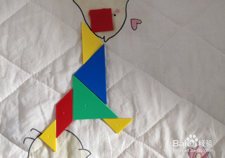 用七巧板智力拼图怎么拼一个跑着的娃娃