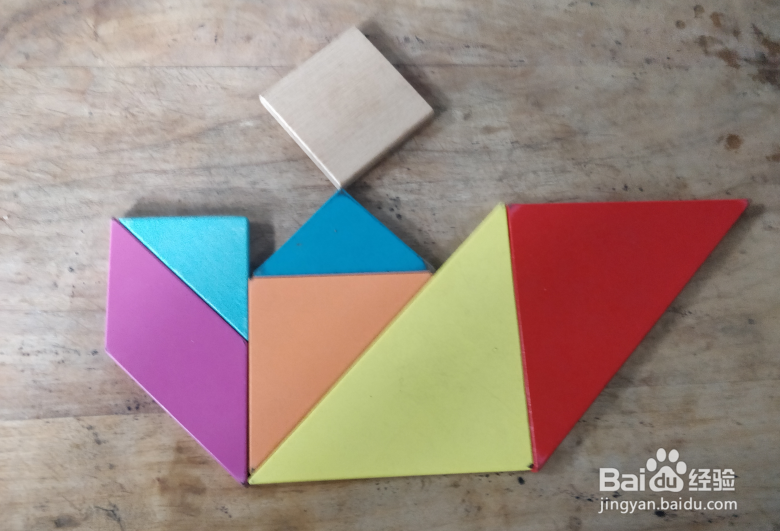 用七巧板怎样拼坐摇摇车的小孩儿