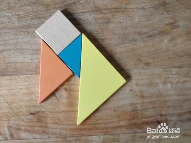 如何用七巧板拼一只抬头吃树叶的羊