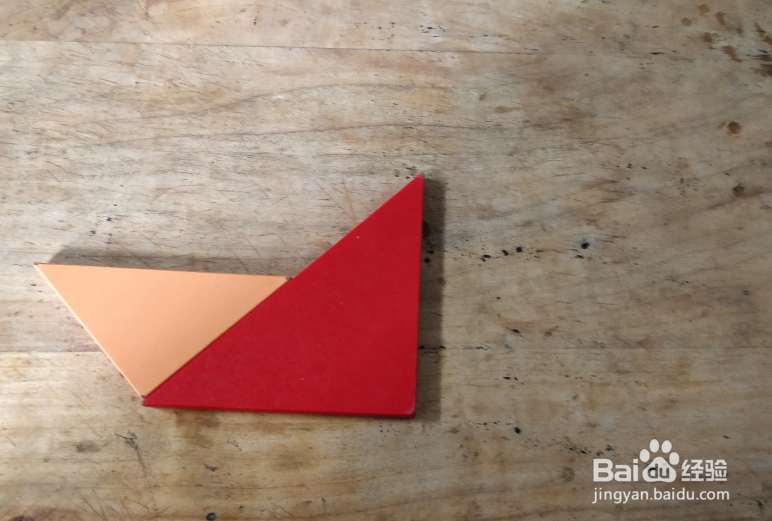 用七巧板怎样拼一个坐在船里的人