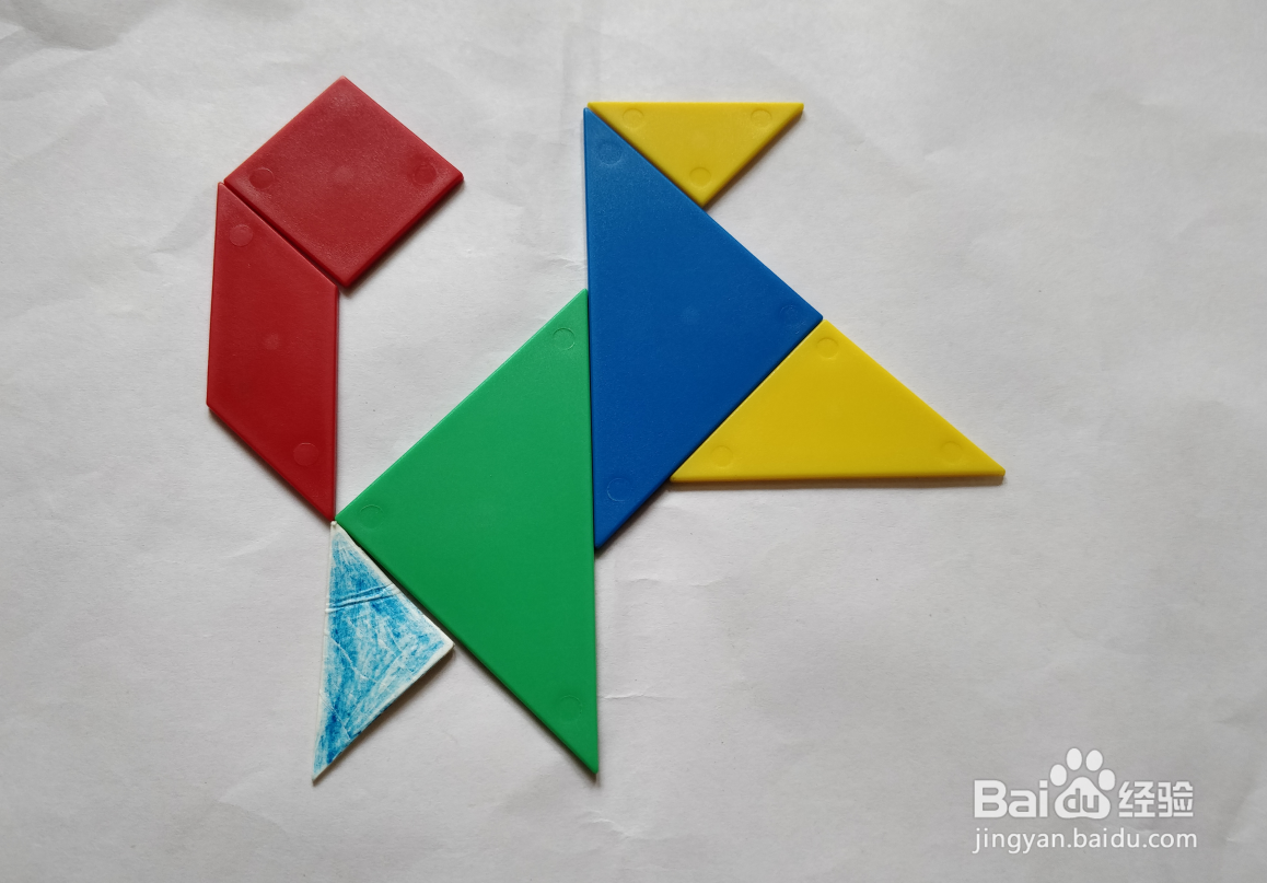 用(蝶式)七巧板怎么拼一只高兴跳跃的狗?