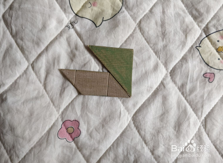 用九巧板怎么拼一个练习游泳的小哥哥呢？