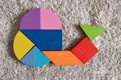 用九巧板拼图玩具怎样拼一只小蜗牛?