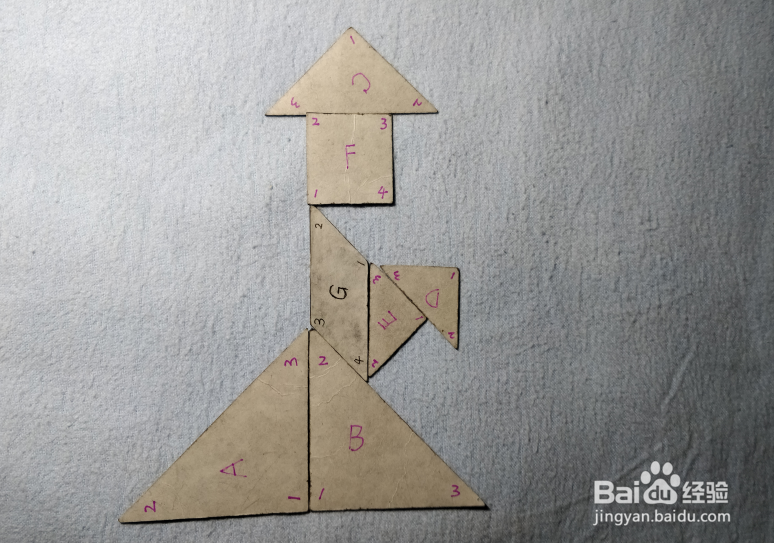 用七巧板怎样拼一个拿着手绢的女士?