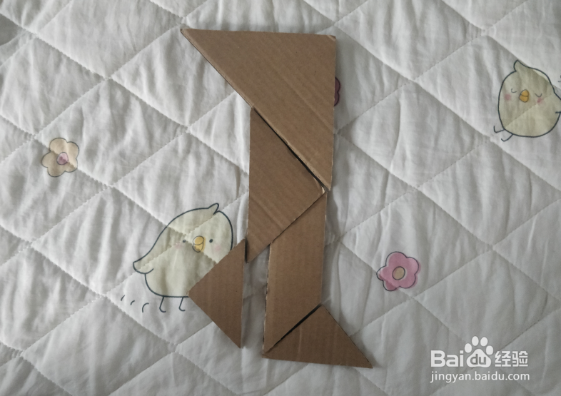 用七巧板怎么拼一个沉思步行的少年呢