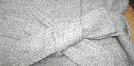 风衣腰带后系法