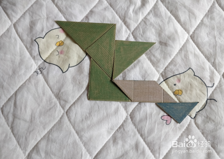 用九巧板怎么拼一个弹跳练习的小哥哥呢？