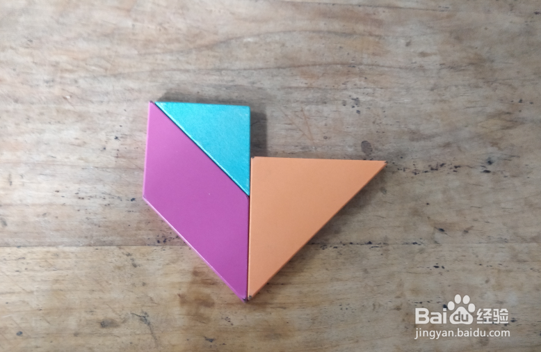 用七巧板怎样拼坐摇摇车的小孩儿