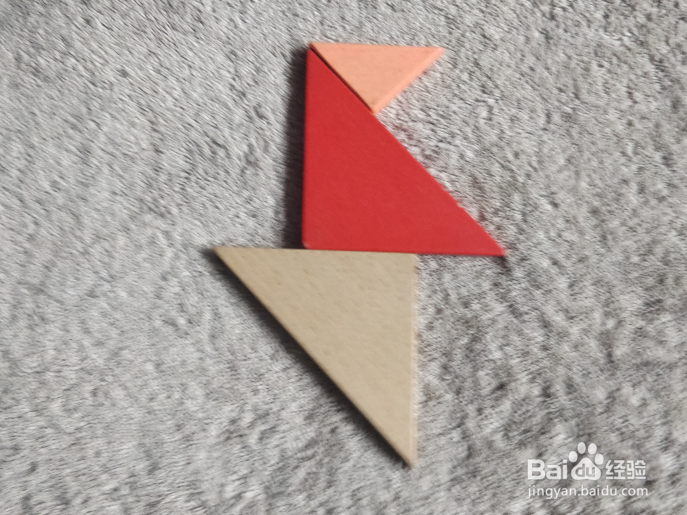 用七巧板怎样拼一个飞跨小水沟的小学生呢？