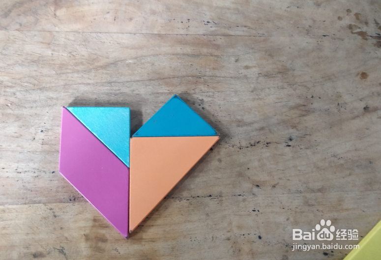 用七巧板怎样拼坐摇摇车的小孩儿