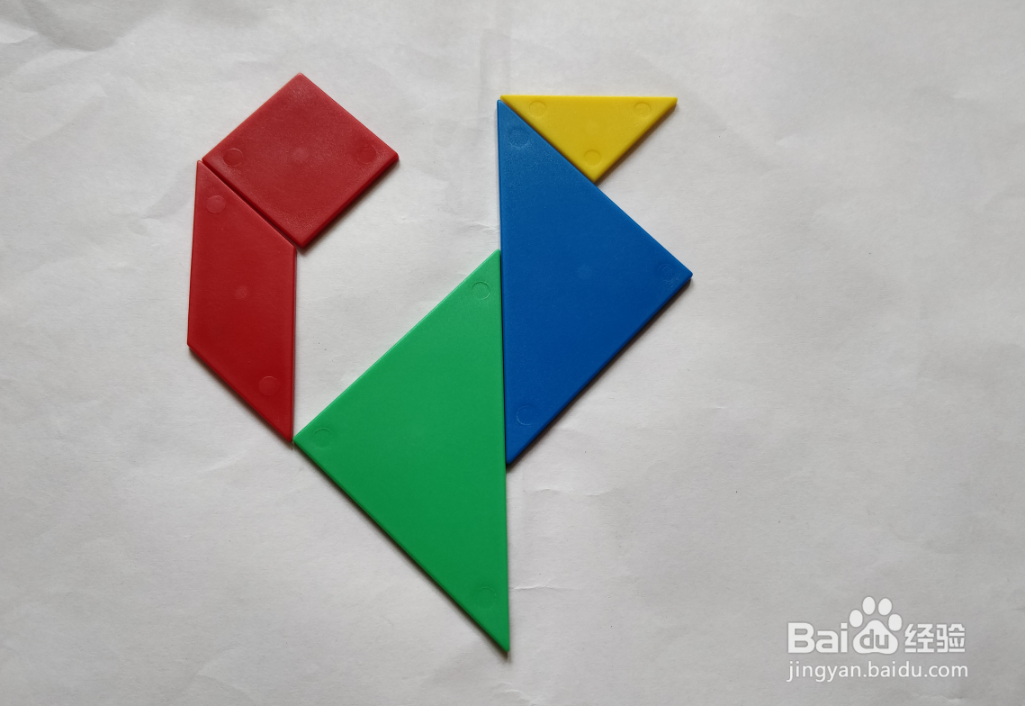 用(蝶式)七巧板怎么拼一只高兴跳跃的狗?