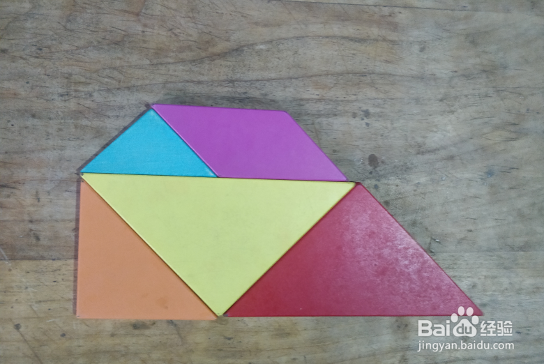 用七巧板怎样拼一座建在小岛上的房子？