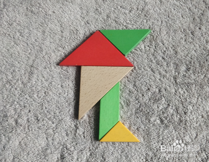 用七巧板怎样拼一个正在伸展运动的小学生呢?