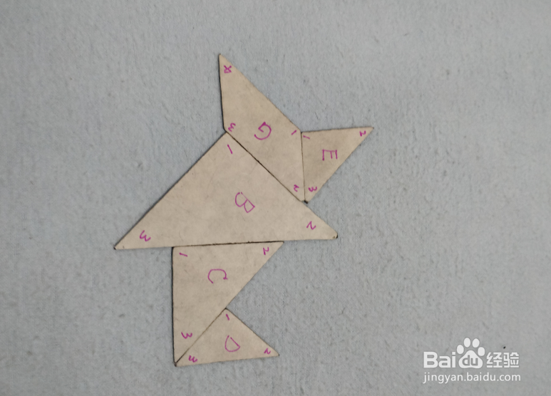 用七巧板怎样拼一个拿着伞的小女孩?