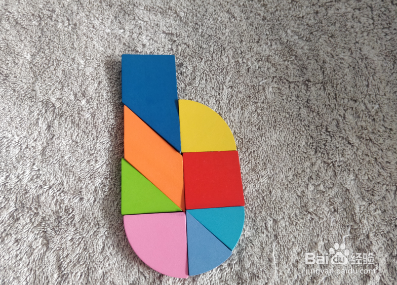 用九巧板拼图玩具怎样拼一只加长的打火机？