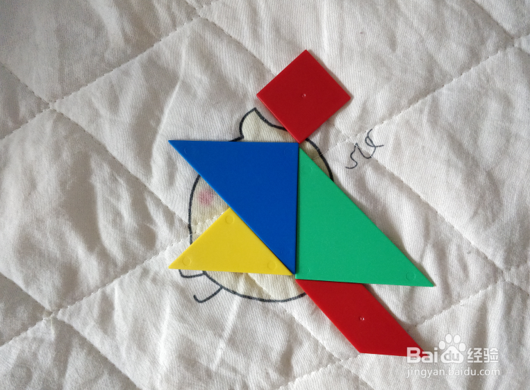 用七巧板智力拼图怎么拼一个赶忙跑出去的人？