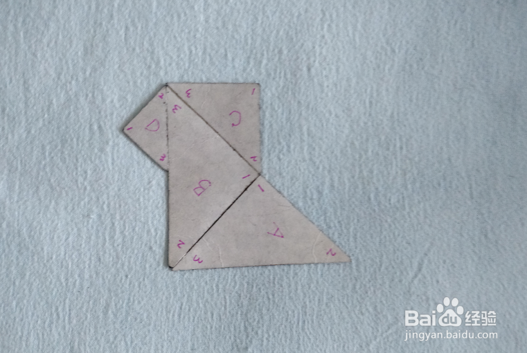 用七巧板怎样拼一只小狮子狗?