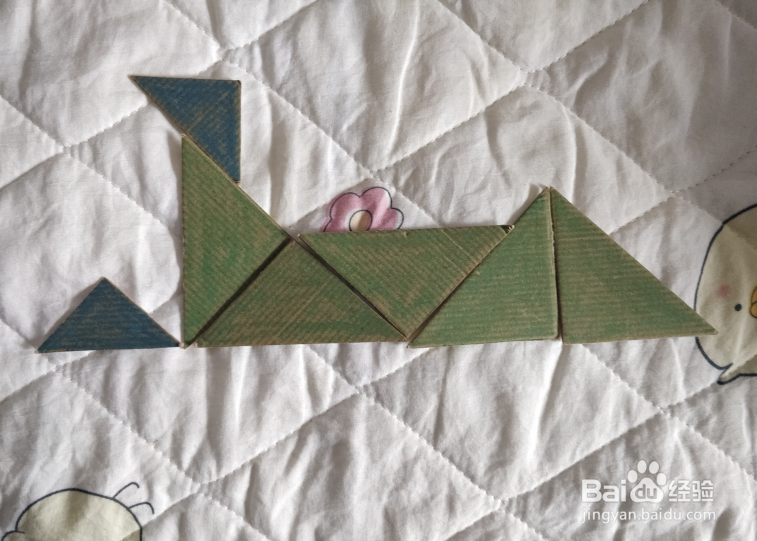 用九巧板怎么拼一个打滚哭闹的小朋友呢?