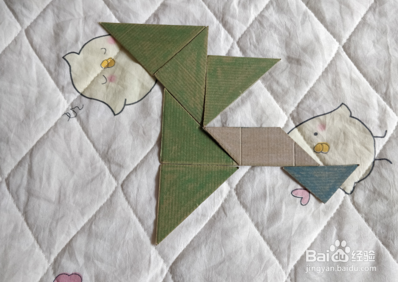 用九巧板怎么拼一个弹跳练习的小哥哥呢？