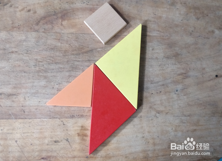 用七巧板怎样拼一个挥胳膊的小孩?