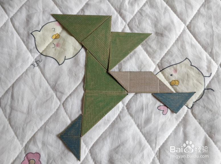 用九巧板怎么拼一个弹跳练习的小哥哥呢？