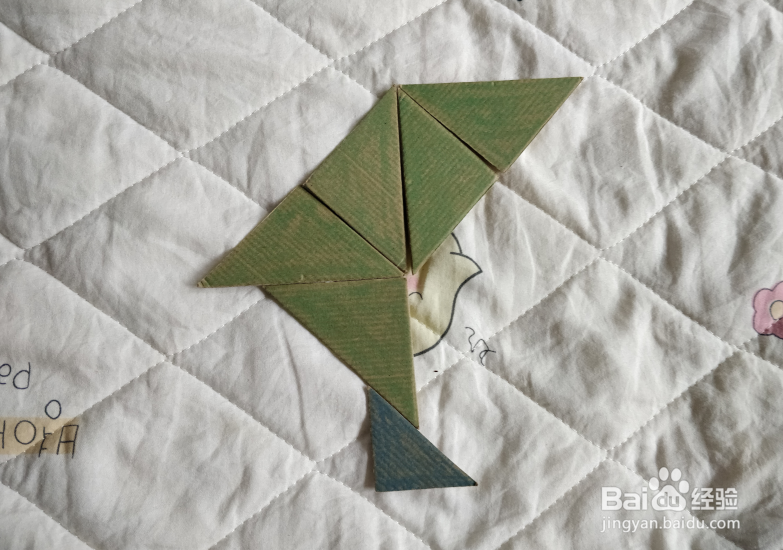 用九巧板怎么拼一个练习舞步的小哥哥呢？