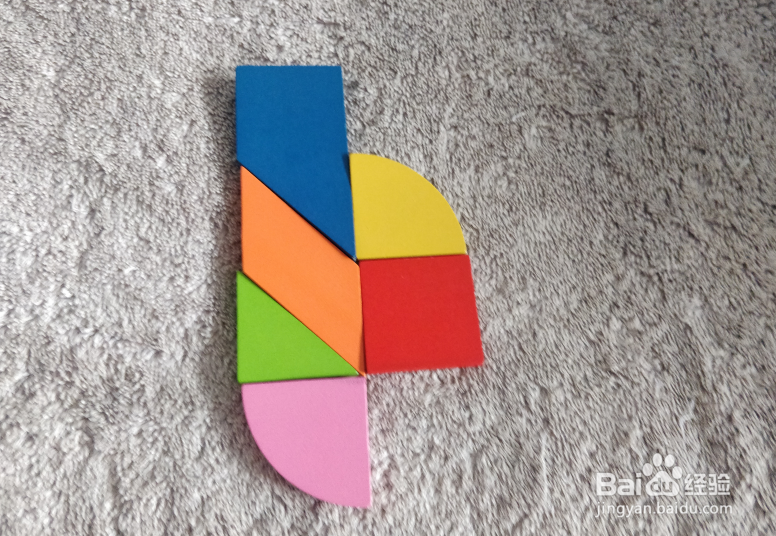 用九巧板拼图玩具怎样拼一只加长的打火机？