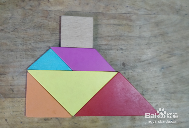 用七巧板怎样拼一座建在小岛上的房子？