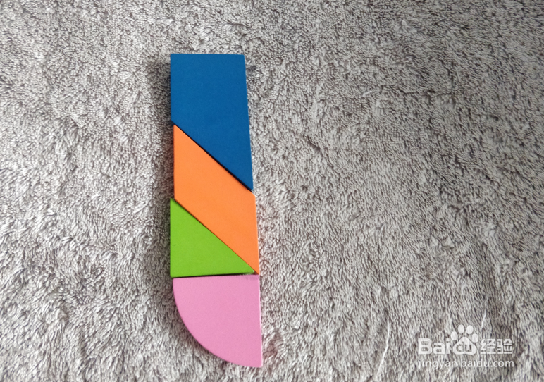 用九巧板拼图玩具怎样拼一只加长的打火机？